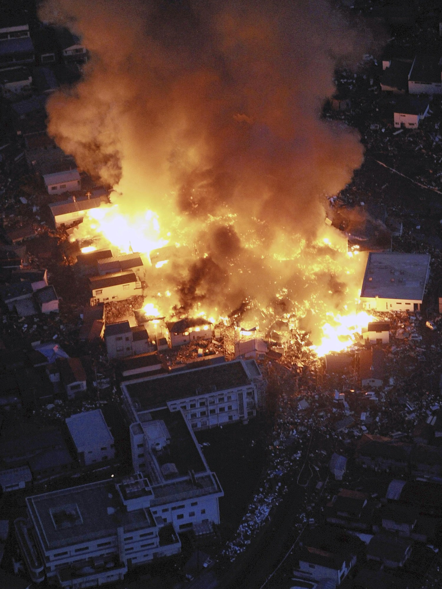 shot at night of buildings on fire