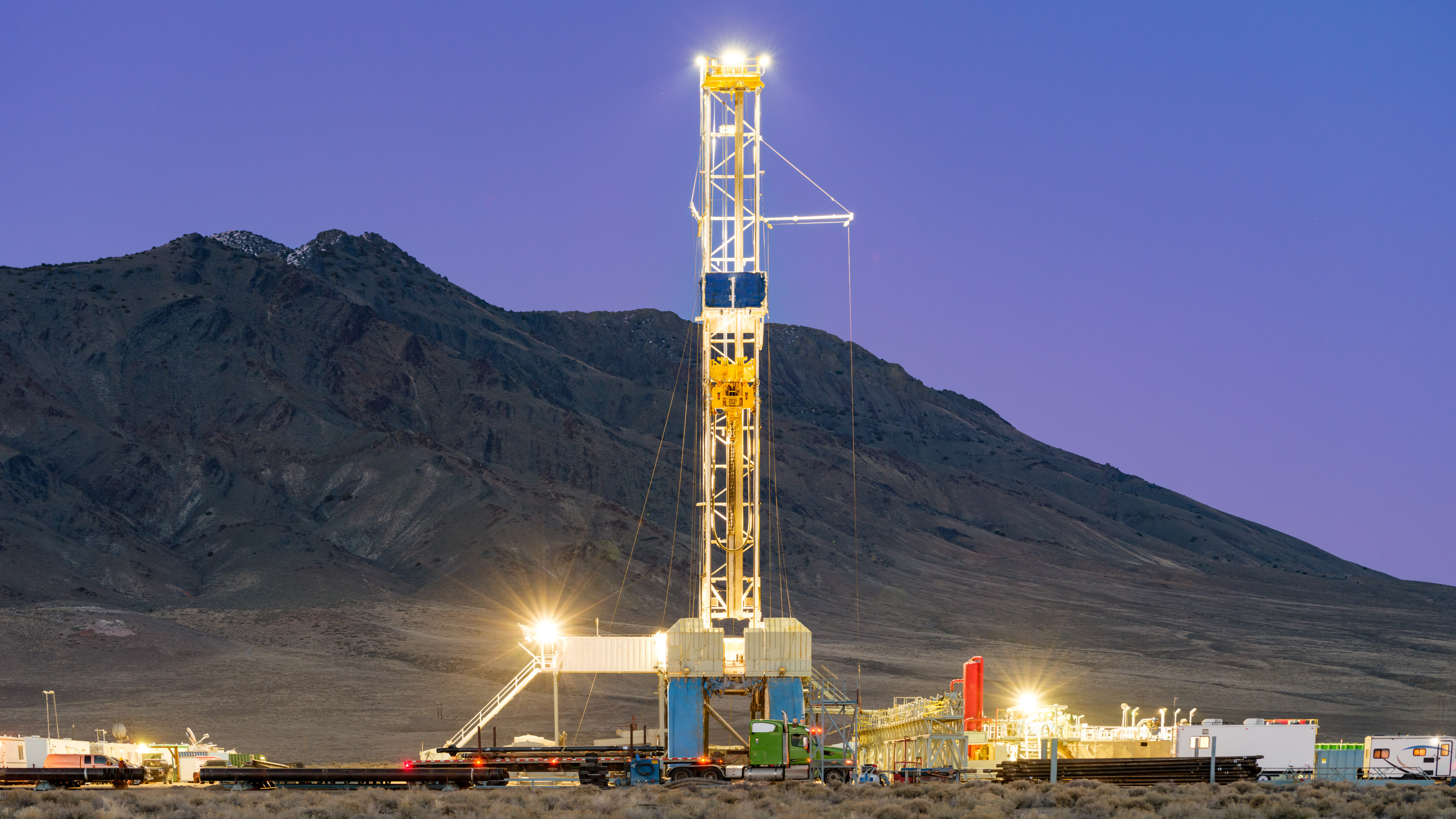 Fervo's Drilling Rig lit up at night